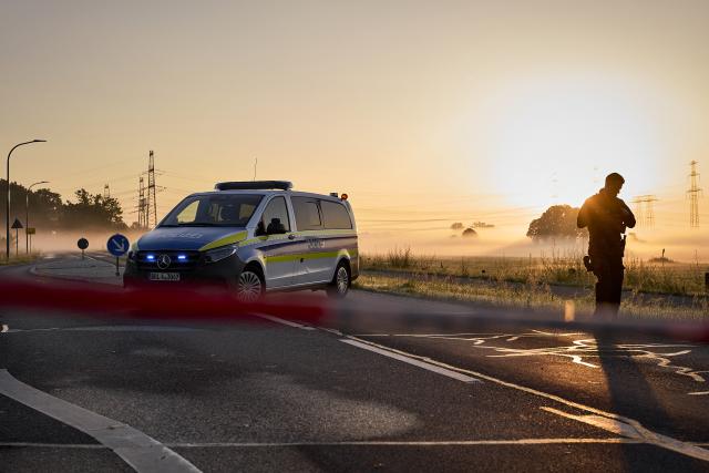 02 September 2026, Brandenburg, Turnow-Preilack: A police vehicle blocks the road leading to the substation. Following the act of sabotage against the power grid in southern Brandenburg, police are continuing to search the scene for clues to help identify the perpetrators. Photo: Michael Ukas/dpa