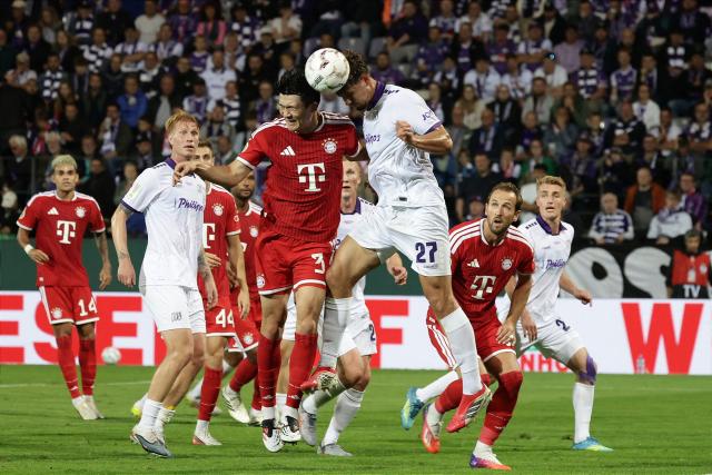 02 September 2026, Lower Saxony, Osnabrueck: Osnabrueck's Robin Fabinski (3rd R) and Bayern Munich's Min-jae Kim battle for the ball during the German Cup (DFB Pokal) first round soccer match between VfL Osnabrueck and FC Bayern Munich at the Stadion an der Bremer Bruecke. Photo: David Ebener/dpa - IMPORTANT NOTICE: Bundesliga and DFB regulations prohibit any use of photographs as image sequences and/or quasi-video.