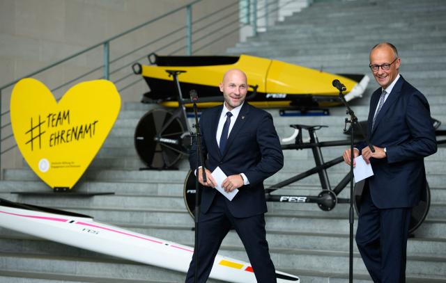 03 September 2026, Berlin: German Chancellor Friedrich Merz introduces two-time Olympic canoeing champion Ronald Rauhe at the Federal Chancellery as the new Minister of State for Sports and Volunteer Work. Rauhe, 44, succeeds Christiane Schenderlein, who left the position to join the Federal Ministry of Health as a Parliamentary State Secretary. Photo: Bernd von Jutrczenka/dpa