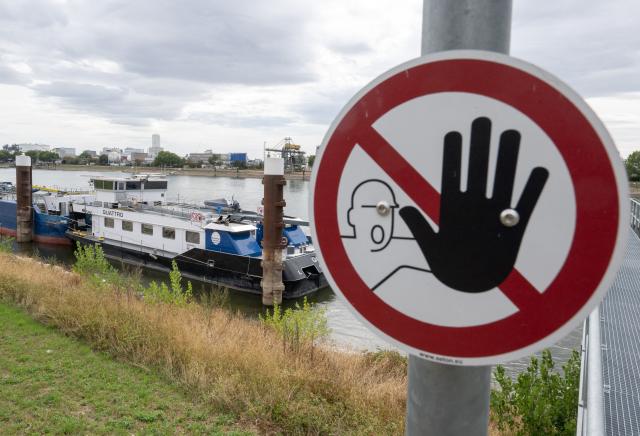 03 September 2026, Baden-Württemberg, Mannheim: Ships are sailing down the Rhine near the BASF plant. Water levels are expected to drop again in the coming weeks. Photo: Boris Roessler/dpa