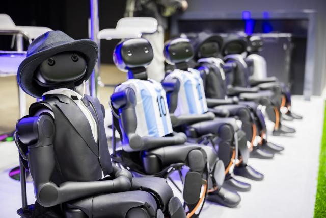 03 September 2026, Berlin: Robots from the company Booster are sitting on a small soccer field during the second press day of the IFA 2026 electronics trade show. IFA 2026 will take place from Friday, September 4, 2026, through Tuesday, September 8, 2026. Photo: Christoph Soeder/dpa