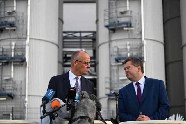 03 September 2026, Saxony-Anhalt, Leuna: German Chancellor Friedrich Merz and Sven Schulze (R), Minister-President of Saxony-Anhalt, give a statement during a visit to the UPM Biochemicals GmbH biorefinery in Leuna. The Chancellor and the Minister President are visiting the facility operated by the Finnish corporation UPM just a few days before the state election in Saxony-Anhalt. Once fully operational, the plant is expected to convert sustainably produced, certified forest biomass into up to 220,000 metric tons of biochemicals annually. Photo: Hendrik Schmidt/dpa