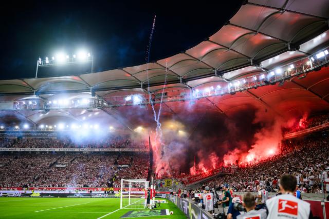 04 September 2026, Baden-Wuerttemberg, Stuttgart: Cologne fans set off pyrotechnics in the stands during the German Bundesliga soccer match between VfB Stuttgart and 1. FC Koeln, at MHPArena. Photo: Tom Weller/dpa - IMPORTANT NOTICE: In accordance with the regulations of the Bundesliga and the DFB (German Football Association), it is prohibited to use or allow the use of photographs taken in the stadium and/or during the game in the form of sequential images and/or video-like photo series.