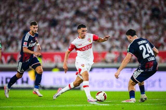 04 September 2026, Baden-Wuerttemberg, Stuttgart: Stuttgart's Bilal El Khannouss and Cologne's Luka Lochoshvili battle for the ball during the German Bundesliga soccer match between VfB Stuttgart and 1. FC Koeln, at MHPArena. Photo: Tom Weller/dpa - IMPORTANT NOTICE: In accordance with the regulations of the Bundesliga and the DFB (German Football Association), it is prohibited to use or allow the use of photographs taken in the stadium and/or during the game in the form of sequential images and/or video-like photo series.