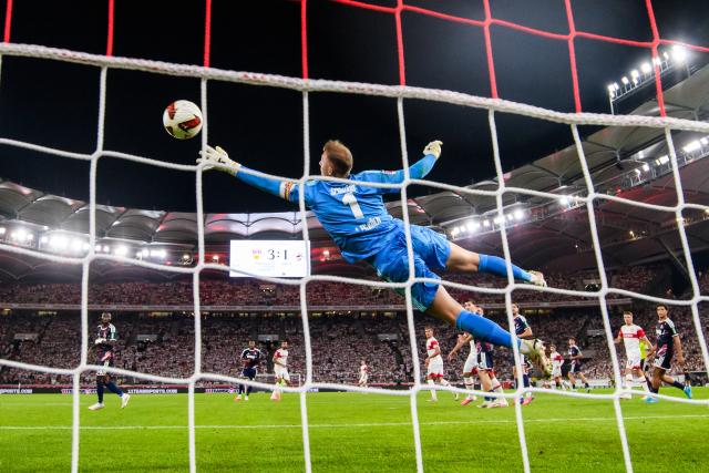 04 September 2026, Baden-Wuerttemberg, Stuttgart: Stuttgart's Josha Vagnoman scores his side's fourth goal past Cologne goalkeeper Marvin Schwaebe during the German Bundesliga soccer match between VfB Stuttgart and 1. FC Koeln, at MHPArena. Photo: Tom Weller/dpa - IMPORTANT NOTICE: In accordance with the regulations of the Bundesliga and the DFB (German Football Association), it is prohibited to use or allow the use of photographs taken in the stadium and/or during the game in the form of sequential images and/or video-like photo series.