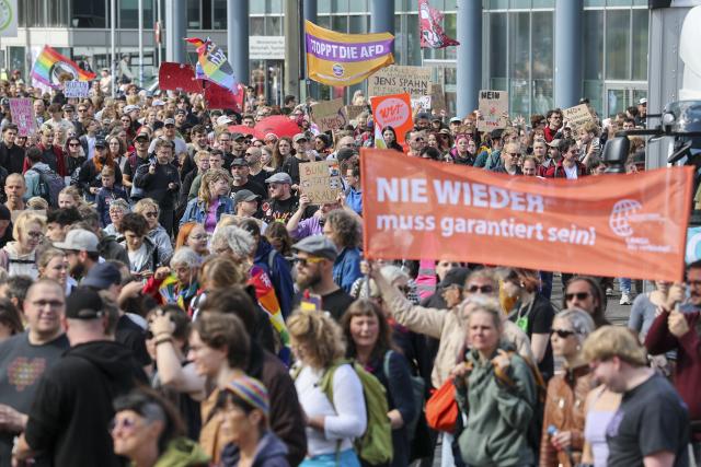 05 September 2026, Saxony-Anhalt, Magdeburg: Protesters march through the city center, carrying a banner that reads "Diverse. Democratic. United." The march began at the main train station and is heading to Domplatz, where a democracy festival organized by the coalition "Saxony-Anhalt. Open to the World" is taking place. Photo: Jan Woitas/dpa
