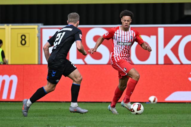 05 September 2026, North Rhine-Westphalia, Paderborn: Freiburg's Derry Scherhant and Paderborn's Jano ter Horst battle for the ball during the German Bundesliga soccer match between SC Paderborn 07 and SC Freiburg at the Home Deluxe Arena. Photo: Swen Pförtner/dpa - IMPORTANT NOTICE: Bundesliga and DFB regulations prohibit any use of photographs as image sequences and/or quasi-video.