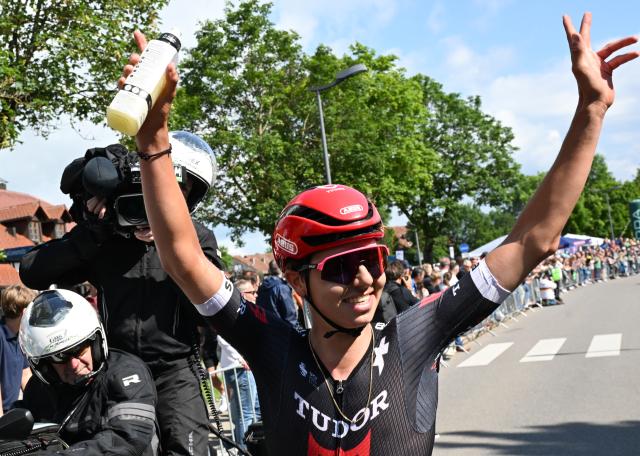 FILED - 23 June 2024, Bad Duerrheim: FILE PHOTO - German cyclist Marco Brenner of Team Tudor Pro Cycling celebrates after crossing the finish line of the Elite Men's Road Race during the 2024 German National Road Race Championships. Photo: Bernd Weißbrod/dpa