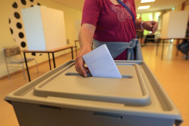 06 September 2026, Saxony-Anhalt, Wernigerode: A voter casts her ballot at a polling station in Wernigerode. Saxony-Anhalt elects a new state parliament on Sunday. Photo: Matthias Bein/dpa
