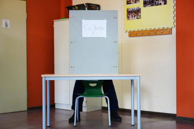 06 September 2026, Saxony-Anhalt, Tangermünde: A voter sits in a voting booth and casts a ballot. Saxony-Anhalt elects a new state parliament on Sunday. Photo: Kay Nietfeld/dpa