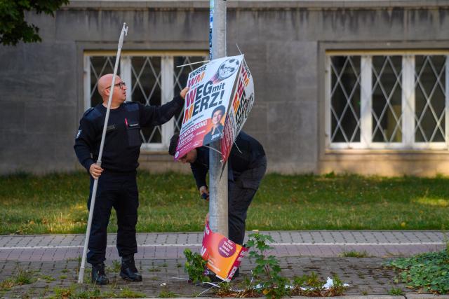 06 September 2026, Saxony-Anhalt, Magdeburg: Public works employees remove campaign posters near a polling station. Saxony-Anhalt elects a new state parliament on Sunday. Photo: Klaus-Dietmar Gabbert/dpa