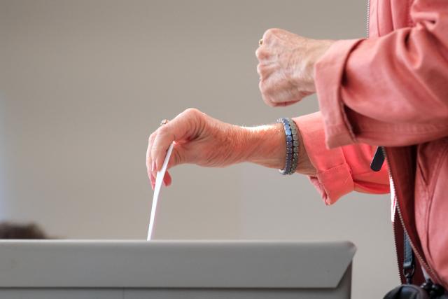 06 September 2026, Saxony-Anhalt, Magdeburg: A voter drops her ballot into a ballot box at a polling station. Saxony-Anhalt elects a new state parliament on Sunday. Photo: Klaus-Dietmar Gabbert/dpa