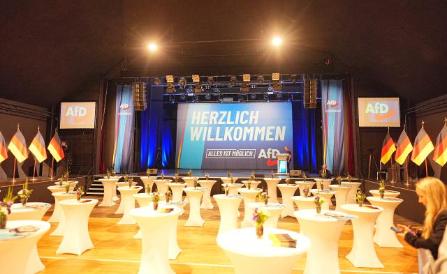 06 September 2026, Saxony-Anhalt, Magdeburg: Bar tables and German flags are set up outside the Alternative for Germany (AfD) election party at the Altes Theater. A new state parliament will be elected in Saxony-Anhalt on Sunday. Photo: Michael Kappeler/dpa