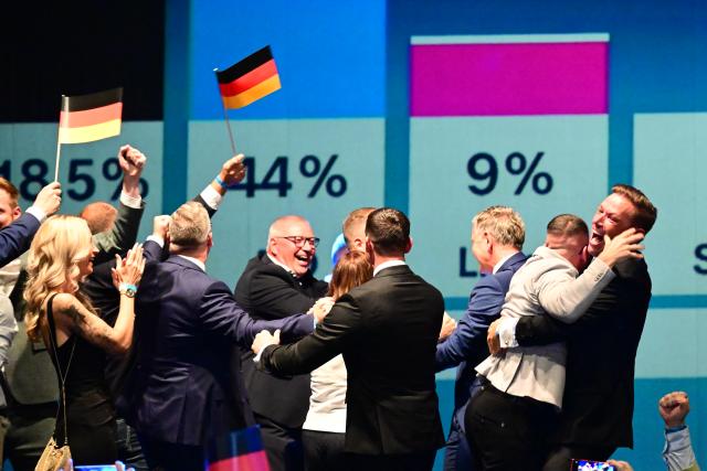 06 September 2026, Saxony-Anhalt, Magdeburg: Alternative for Germany (AfD) supporters react to the projections for the Saxony-Anhalt state election results at the AfD's election party at the Altes Theater. Photo: Sebastian Gollnow/dpa