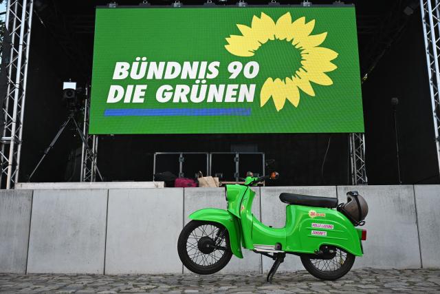 06 September 2026, Saxony-Anhalt, Magdeburg: A Simson Schwalbe motorcycle is parked in front of the stage before the start of the Alliance 90/The Greens election party at Festung Mark. Photo: Michael Brandt/dpa