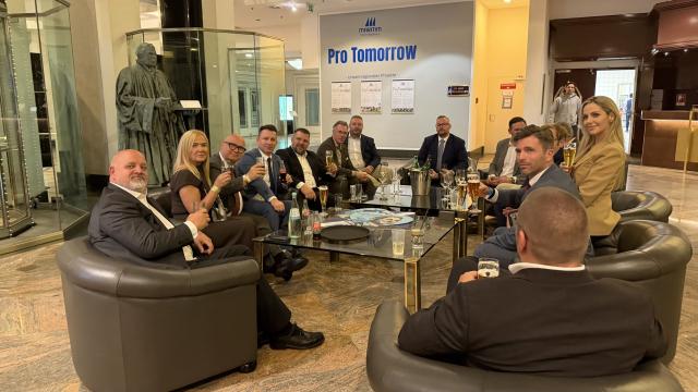 07 September 2026, Saxony-Anhalt, Magdeburg: Oliver Kirchner (3rd L), co-leader of the AfD parliamentary group in Saxony-Anhalt, sits with fellow party members in the lobby of the Maritim Hotel, where the CDU of Saxony-Anhalt is holding its election campaign party. Photo: Simon Kremer/dpa
