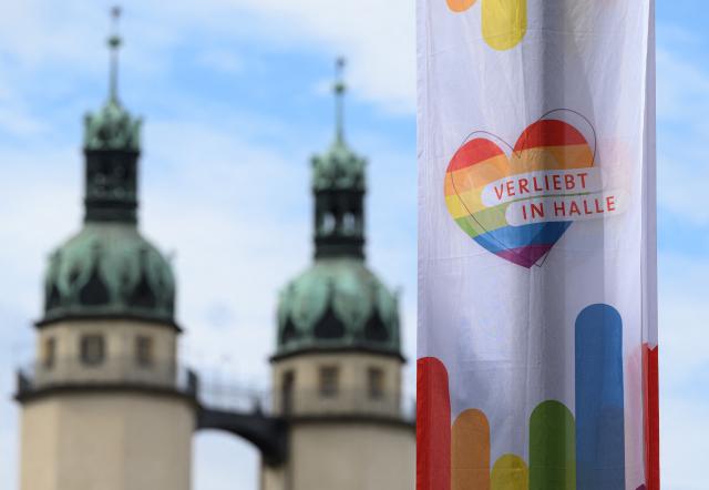 07 September 2026, Saxony-Anhalt, Halle: Rainbow flags fly in the market square in Halle/Saale, with the towers of the Marktkirche in the background. Saxony-Anhalt elected a new state parliament on Sunday, 6 September 2026. Photo: Hendrik Schmidt/dpa