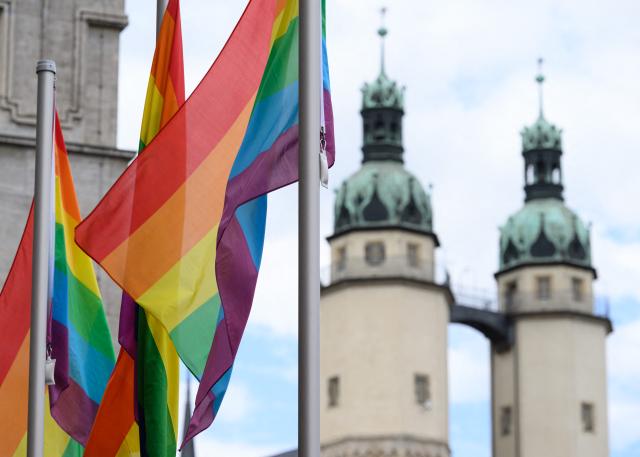 07 September 2026, Saxony-Anhalt, Halle: Rainbow flags fly in the market square in Halle/Saale, with the towers of the Marktkirche in the background. Saxony-Anhalt elected a new state parliament on Sunday, 6 September 2026. Photo: Hendrik Schmidt/dpa