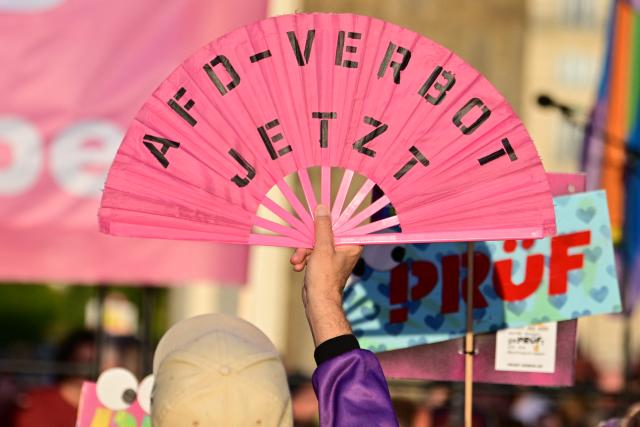 07 September 2026, Berlin: A person holds up a fan bearing the slogan "Ban the AfD Now" at a demonstration at the Brandenburg Gate. Under the slogan "Time to Act: Stop the AfD!", Campact and Fridays for Future had called for the rally after the results of the Saxony-Anhalt state election. Photo: Fabian Sommer/dpa