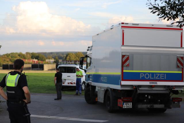 07 September 2026, North Rhine-Westphalia, Weisweiler: Police officers stand on a street during an operation at the Weisweiler power plant. Following a series of acts of sabotage, the police have expanded their investigation and manhunt. Photo: -/dpa