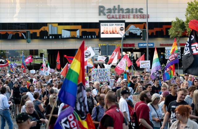 07 September 2026, North Rhine-Westphalia, Essen: Demonstrators hold signs during a march through downtown Essen in response to the Alternative for Germany (AfD) strong showing in the state legislative elections in Saxony-Anhalt. Photo: Fabian Strauch/dpa