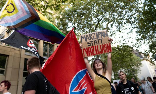 07 September 2026, North Rhine-Westphalia, Essen: A participant holds up a sign that reads "Marzipan Instead of Nazi Madness" during a march through downtown Essen in response to the Alternative for Germany (AfD) strong showing in the state legislative elections in Saxony-Anhalt. Photo: Fabian Strauch/dpa