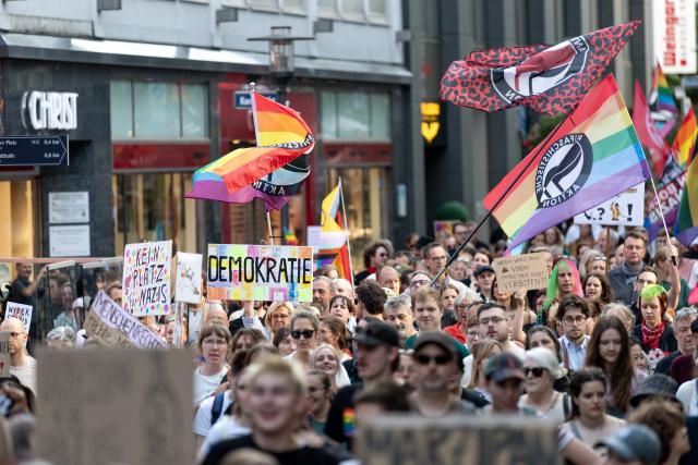 07 September 2026, North Rhine-Westphalia, Essen: Demonstrators hold signs during a march through downtown Essen in response to the Alternative for Germany (AfD) strong showing in the state legislative elections in Saxony-Anhalt. Photo: Fabian Strauch/dpa