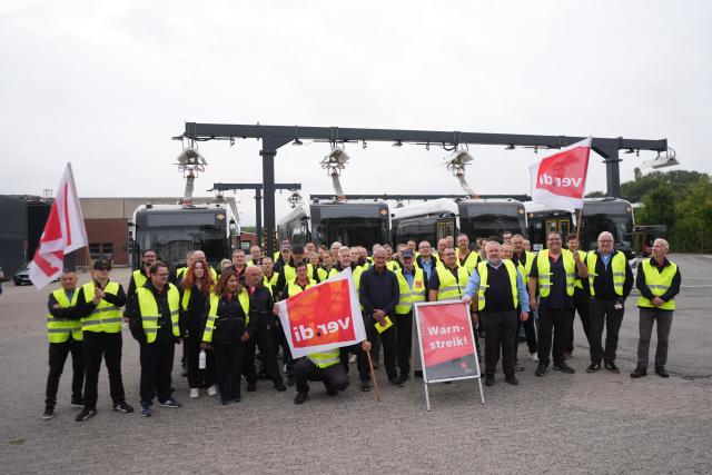 08 September 2026, Schleswig-Holstein, Kiel: Striking employees gather at the KVG Kieler Transport company depot. The Verdi service workers' union has called for a warning strike in local public transportation in some cities. Photo: Marcus Brandt/dpa