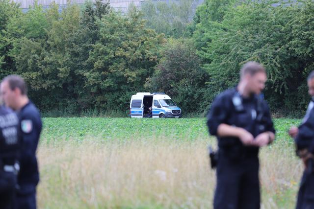 08 September 2026, North Rhine-Westphalia, Eschweiler: German Police officers work in and around a field near the Weisweiler power plant. Since Monday afternoon, a large number of police officers have been deployed around the power plant and have been conducting an intensive search for the suspect, who is believed to have carried out several acts of sabotage against the German power grid. Photo: Sascha Thelen/dpa