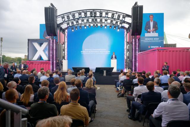 08 September 2026, North Rhine-Westphalia, Cologne: Hendrik Wuest, Minister President of North Rhine-Westphalia, speaks at Deutsche Telekom's Digital X trade show. Photo: Henning Kaiser/dpa