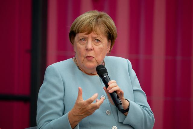 08 September 2026, North Rhine-Westphalia, Cologne: Germany's former Chancellor Angela Merkel speaks at Deutsche Telekom's Digital X trade show. Photo: Henning Kaiser/dpa