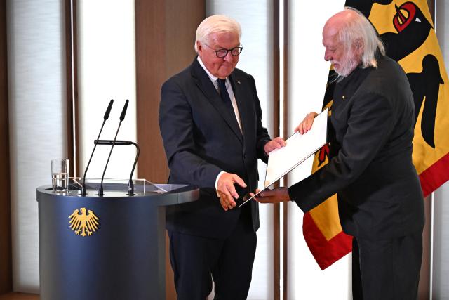 08 September 2026, Berlin: German President Frank-Walter Steinmeier (L) presents the Grand Cross with Star of the Order of Merit of the Federal Republic of Germany to Nobel Prize winner in Literature laureate Laszlo Krasznahorkai at the presidential residence on the Spreebogen. 
The Hungarian writer was awarded the Nobel Prize in Literature last year. Photo: Michael Brandt/dpa