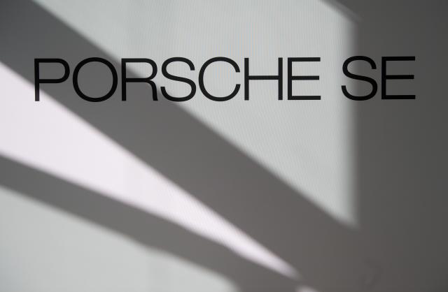 FILED - 19 March 2019, Baden-Württemberg, Stuttgart: FILE PHOTO - The Porsche logo can be seen on a partition wall during the company's financial results press conference. Photo: Marijan Murat/dpa