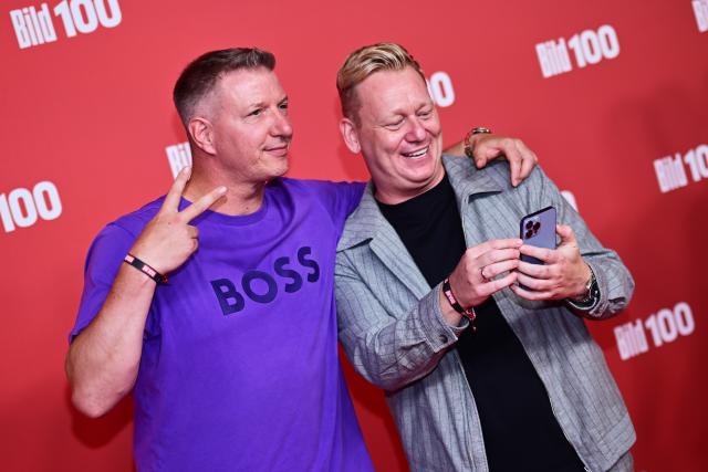 08 September 2026, Berlin: German entertainer Jens Knossalla (R) and host Max Schradin stand on the red carpet at Axel Springer's BILD100 event. Photo: Sebastian Christoph Gollnow/dpa