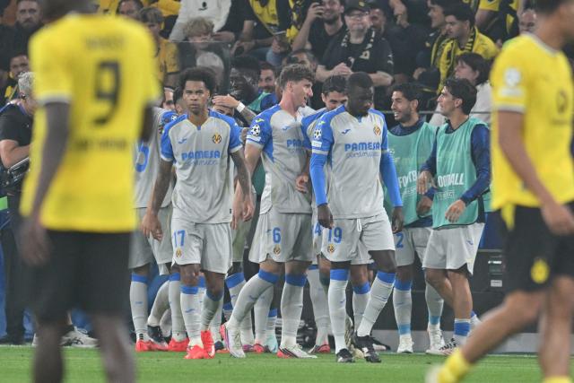 08 September 2026, North Rhine-Westphalia, Dortmund: Villarreal players celebrate their side's first goal during the UEFA Champions League group stage soccer match between Borussia Dortmund and Villarreal CF at Signal Iduna Park. Photo: Bernd Thissen/dpa