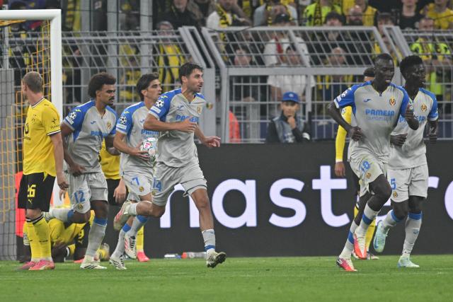 08 September 2026, North Rhine-Westphalia, Dortmund: Villarreal players celebrate their side's second goal during the UEFA Champions League group stage soccer match between Borussia Dortmund and Villarreal CF at Signal Iduna Park. Photo: Bernd Thissen/dpa