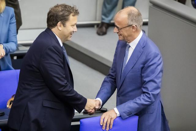 09 September 2026, Berlin: Germany's Chancellor Friedrich Merz (R) and Lars Klingbeil, Germany's Minister of Finance and co-chair of the Social Democratic Party (SPD), speak with each other before the general debate during budget deliberations in the German Bundestag. Photo: Christoph Soeder/dpa