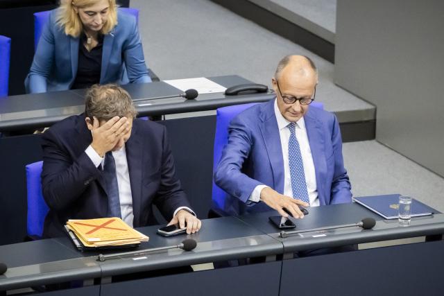 09 September 2026, Berlin: Germany's Chancellor Friedrich Merz (R) and Lars Klingbeil, Germany's Minister of Finance and co-chair of the Social Democratic Party (SPD), speak with each other before the general debate during budget deliberations in the German Bundestag. Photo: Christoph Soeder/dpa