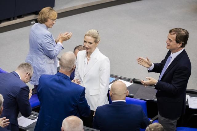 09 September 2026, Berlin: Alice Weidel (C), federal chairwoman and parliamentary group leader of the AfD, is congratulated by members of the AfD parliamentary group following her speech during the general debate as part of the budget deliberations in the Bundestag. Photo: Christoph Soeder/dpa