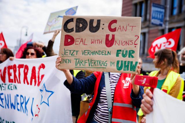 10 September 2026, Berlin: Employees of Unionhilfswerk take part in a rally outside the House of Representatives during a three-day warning strike over a collective bargaining dispute. Photo: Carsten Koall/dpa