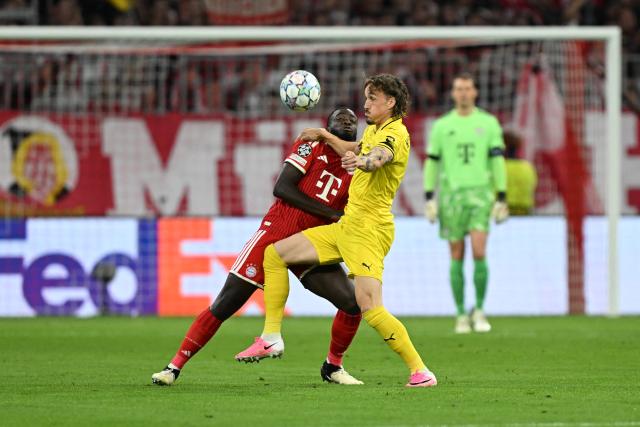 10 September 2026, Bavaria, Munich: Bayern Munich's Dayot Upamecano (L) and Bodo/Glimt's Andreas Helmersen battle for the ball during the UEFA Champions League group stage soccer match between Bayern Munich and FK Bodo/Glimt at Allianz Arena. Photo: Sven Hoppe/dpa