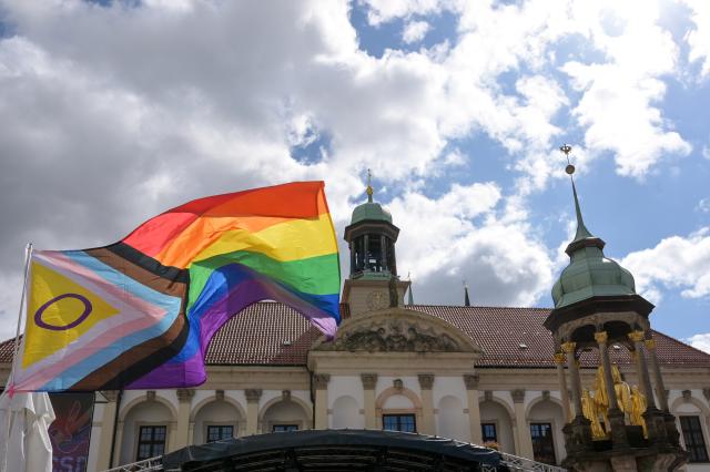 FILED - 23 August 2025, Saxony-Anhalt, Magdeburg: FILE PHOTO - A rainbow-colored flag flies in front of City Hall during Christopher Street Day in Magdeburg. According to the Queer Diversity Association (LSVD), the AfD's election victory in Saxony-Anhalt threatens to worsen the already difficult situation for queer people and other marginalized groups. Photo: Heiko Rebsch/dpa