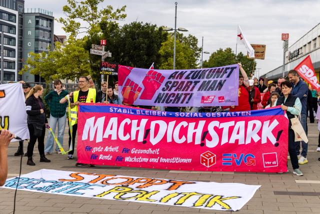 12 September 2026, Brandenburg, Cottbus: Participants in a labour union demonstration march through the city centre. Members of the ver.di, BAU and EVG labour unions are demonstrating under the slogan "Enough Is Enough" against planned social cuts in Germany. Photo: Frank Hammerschmidt/dpa
