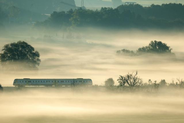 13 September 2026, Baden-Wuerttemberg, Riedlingen: A regional express train travels through the fog this morning. Photo: Thomas Warnack/dpa
