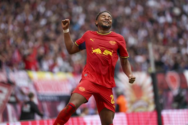 13 September 2026, Saxony, Leipzig: Leipzig's Christopher Nkunku celebrates scoring his side's fourth goal during the German Bundesliga soccer match between RB Leipzig and Hamburger SV at Red Bull Arena. Photo: Jan Woitas/dpa - IMPORTANT NOTICE: In accordance with the regulations of the Bundesliga and the DFB (German Football Association), it is prohibited to use or allow the use of photographs taken in the stadium and/or during the game in the form of sequential images and/or video-like photo sequences.