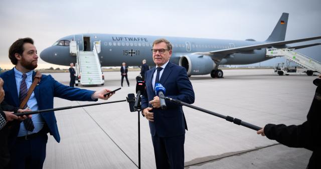 14 September 2026, Brandenburg, Schoenefeld: German Minister of Foreign Affairs, Johann Wadephul, speaks to members of the media at the military section of Berlin-Brandenburg Airport, before flying to Budapest, Hungary. For the first time since the change in government this spring, German Foreign Minister Wadephul is spending a day in the Hungarian capital, Budapest. Photo: Bernd von Jutrczenka/dpa
