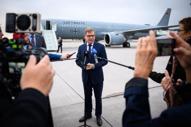 14 September 2026, Brandenburg, Schoenefeld: German Minister of Foreign Affairs, Johann Wadephul, speaks to members of the media at the military section of Berlin-Brandenburg Airport, before flying to Budapest, Hungary. For the first time since the change in government this spring, German Foreign Minister Wadephul is spending a day in the Hungarian capital, Budapest. Photo: Bernd von Jutrczenka/dpa