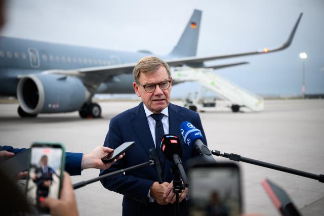 14 September 2026, Brandenburg, Schoenefeld: German Minister of Foreign Affairs, Johann Wadephul, speaks to members of the media at the military section of Berlin-Brandenburg Airport, before flying to Budapest, Hungary. For the first time since the change in government this spring, German Foreign Minister Wadephul is spending a day in the Hungarian capital, Budapest. Photo: Bernd von Jutrczenka/dpa