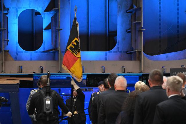14 September 2026, Mecklenburg-Western Pomerania, Wolgast: Keel laying for the third Class 424 fleet service vessel takes place in the Peene-Werft shipyard hall. Production of the latest generation of reconnaissance ships is overseen by Rheinmetall's Naval Systems division and carried out at the Wolgast and Hamburg sites. Photo: Stefan Sauer/dpa