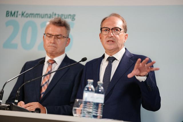 14 September 2026, Berlin: German Interior Minister Alexander Dobrindt (R) speaks alongside German Association of Counties President Achim Broetel, during a press conference at the Interior Ministry's municipal conference. The conference focuses on civil defense, democratic resilience, information security, the fight against organized crime, and the Future Pact between the federal government, the states and local governments. Photo: Kay Nietfeld/dpa